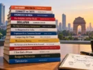 Stack of Indian business books for aspiring entrepreneurs on a wooden desk